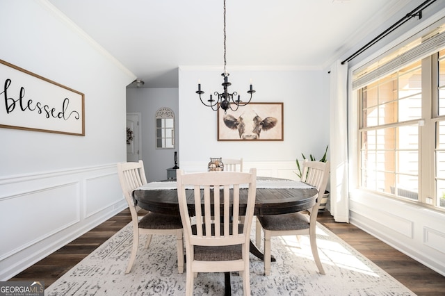 3537 Edenridge Ct, Buford, GA 30519 - dining area with dark wood-style flooring, ornamental molding, a chandelier, a decorative wall, and a wainscoted wall