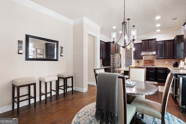 2470 Anderson Estates Ct, Marietta, GA 30064 - dining room featuring a chandelier, baseboards, ornamental molding, recessed lighting, and dark wood-style flooring