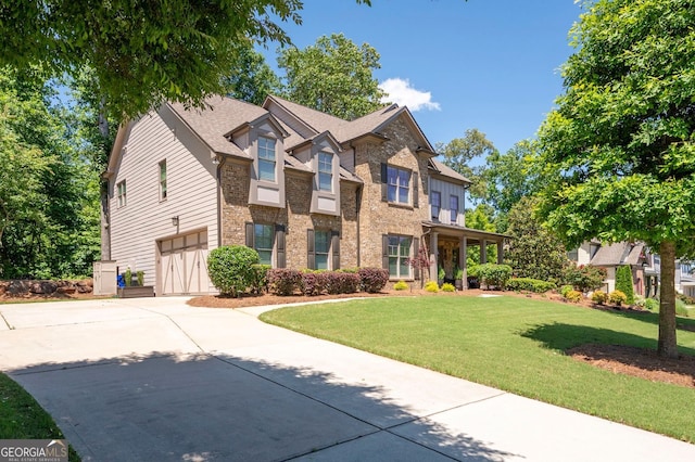 2470 Anderson Estates Ct, Marietta, GA 30064 - view of front facade with a garage, concrete driveway, a front lawn, and brick siding