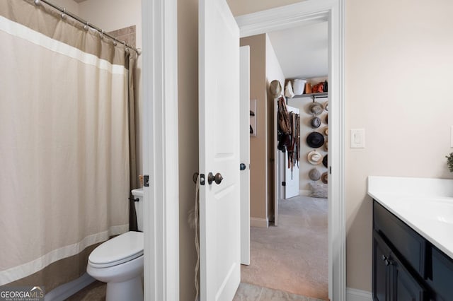 2470 Anderson Estates Ct, Marietta, GA 30064 - full bathroom with vanity, toilet, a shower with curtain, and baseboards