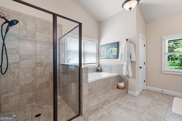 2470 Anderson Estates Ct, Marietta, GA 30064 - full bath featuring a bath, a stall shower, vaulted ceiling, and baseboards
