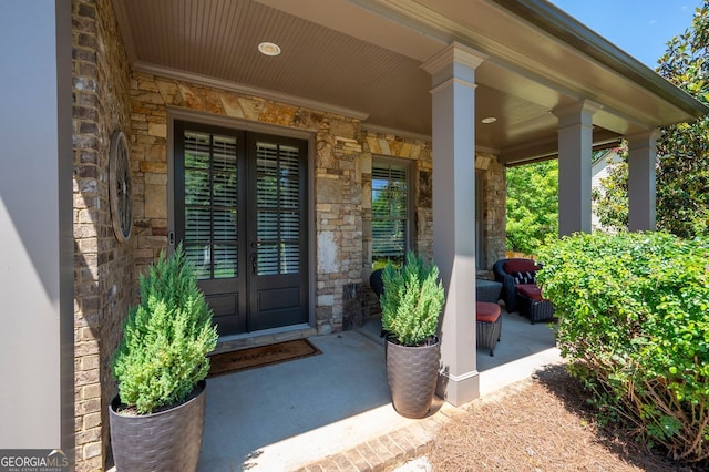 2470 Anderson Estates Ct, Marietta, GA 30064 - doorway to property with stone siding, french doors, and covered porch