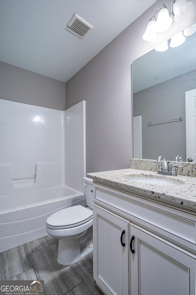 217 Huntington Shoals Dr, Athens, GA 30606 - bathroom featuring vanity, toilet, and shower / bathtub combination