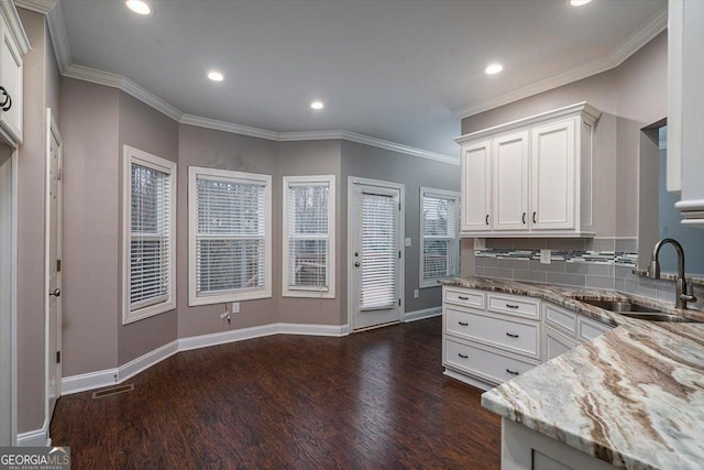 217 Huntington Shoals Dr, Athens, GA 30606 - kitchen featuring a sink, dark wood-type flooring, white cabinets, light stone countertops, and recessed lighting