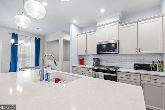 55 Clubhouse Way, Acworth, GA 30101 - kitchen with stainless steel appliances, decorative backsplash, decorative light fixtures, white cabinets, and recessed lighting