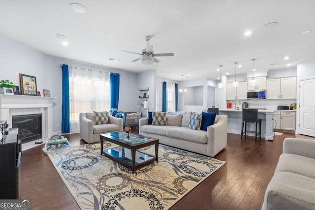 55 Clubhouse Way, Acworth, GA 30101 - living area featuring a ceiling fan, dark wood-style flooring, a glass covered fireplace, and recessed lighting