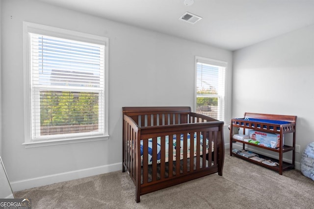 55 Clubhouse Way, Acworth, GA 30101 - carpeted bedroom featuring a crib and baseboards
