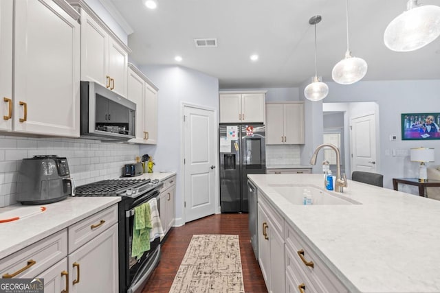 55 Clubhouse Way, Acworth, GA 30101 - kitchen featuring stainless steel appliances, dark wood finished floors, backsplash, hanging light fixtures, and white cabinetry