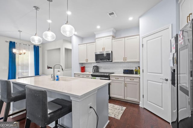 55 Clubhouse Way, Acworth, GA 30101 - kitchen featuring stainless steel appliances, decorative backsplash, light countertops, white cabinetry, and a chandelier