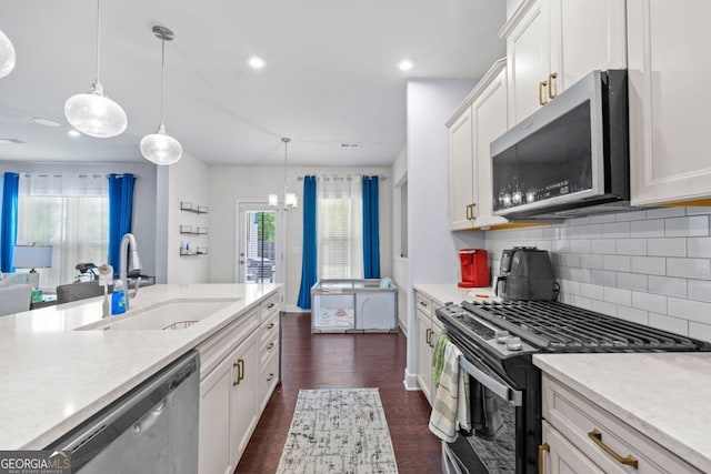 55 Clubhouse Way, Acworth, GA 30101 - kitchen featuring appliances with stainless steel finishes, decorative backsplash, white cabinets, dark wood-type flooring, and recessed lighting