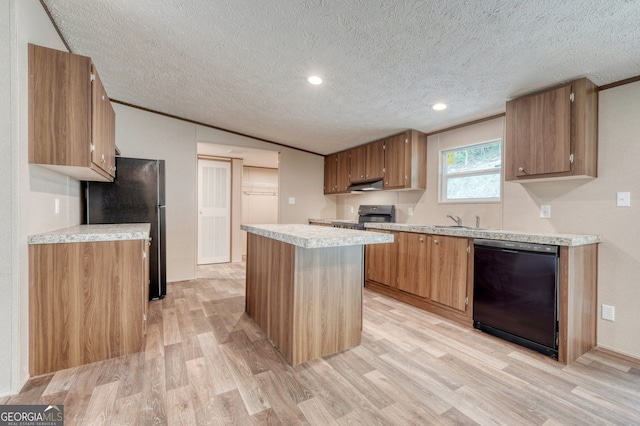 64 Town View Cir, Blairsville, GA 30512 - kitchen featuring black appliances, light wood finished floors, a kitchen island, under cabinet range hood, and light countertops