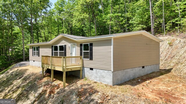 64 Town View Cir, Blairsville, GA 30512 - manufactured / mobile home with crawl space, a wooden deck, and a forest view