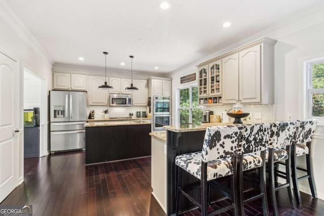 25 Grange Ct, Sharpsburg, GA 30277 - kitchen featuring appliances with stainless steel finishes, a peninsula, backsplash, glass insert cabinets, and light stone counters