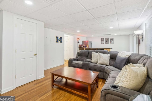 25 Grange Ct, Sharpsburg, GA 30277 - living room with wood finished floors, a paneled ceiling, and recessed lighting