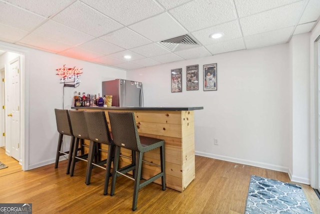 25 Grange Ct, Sharpsburg, GA 30277 - indoor dry bar featuring freestanding refrigerator, a drop ceiling, wood finished floors, and recessed lighting