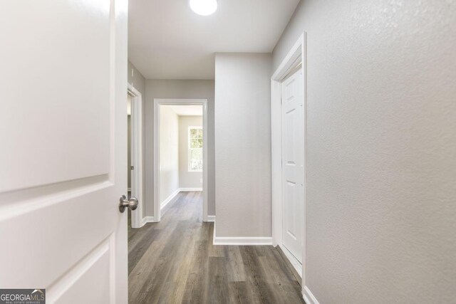 108 Holly St, Warner Robins, GA 31093 - corridor featuring dark wood-type flooring, baseboards, and a textured wall