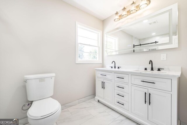 108 Holly St, Warner Robins, GA 31093 - full bathroom with marble finish flooring, toilet, and double vanity