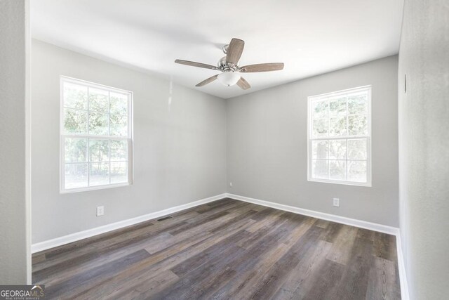 108 Holly St, Warner Robins, GA 31093 - spare room with plenty of natural light, dark wood finished floors, baseboards, and a ceiling fan