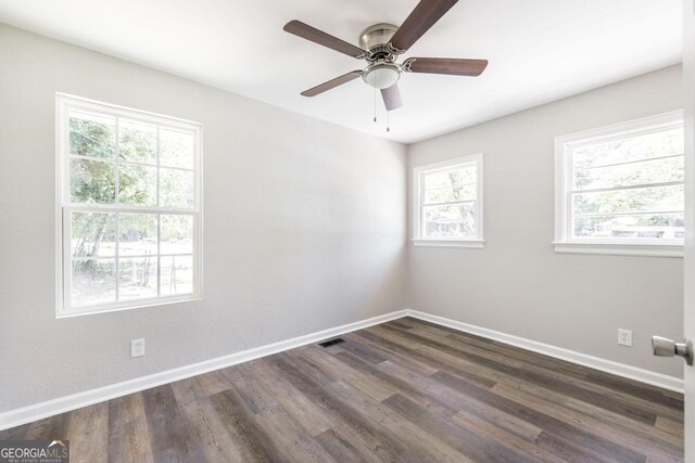 108 Holly St, Warner Robins, GA 31093 - unfurnished room featuring baseboards, dark wood finished floors, and a ceiling fan