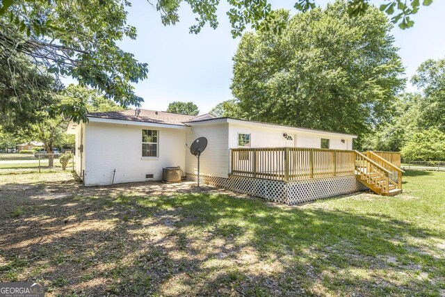 108 Holly St, Warner Robins, GA 31093 - back of property with crawl space and a wooden deck