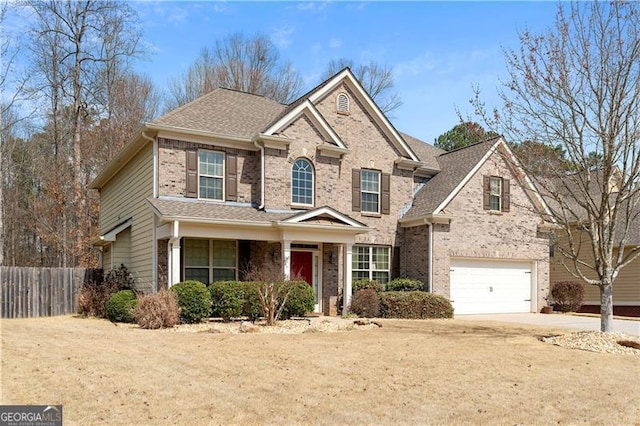1070 Cureton Dr, Austell, GA 30106 - traditional-style home with brick siding, an attached garage, concrete driveway, and roof with shingles