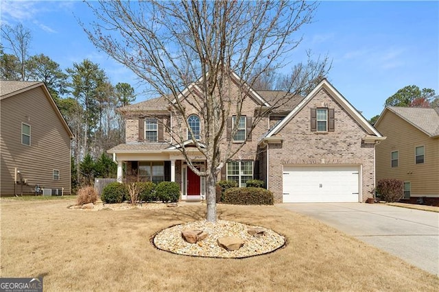 1070 Cureton Dr, Austell, GA 30106 - traditional home with concrete driveway, brick siding, and a garage