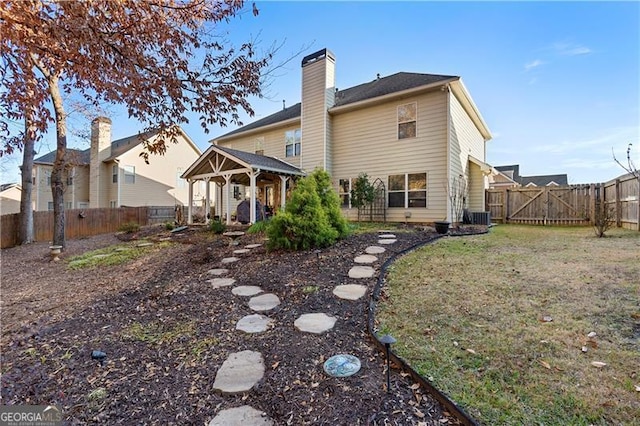 1070 Cureton Dr, Austell, GA 30106 - rear view of property with a gazebo, a fenced backyard, a chimney, and a gate