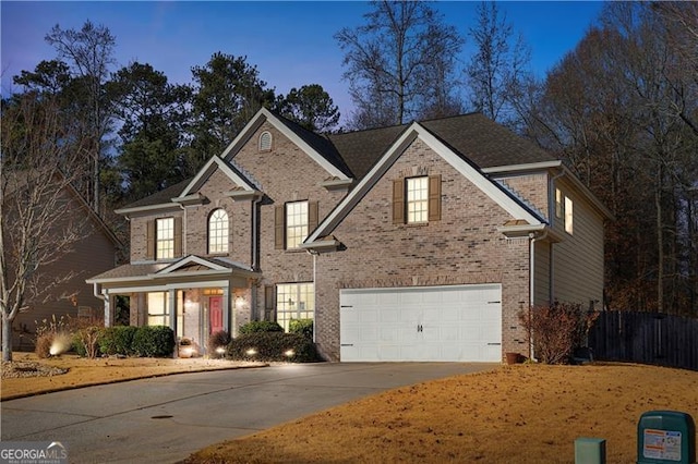 1070 Cureton Dr, Austell, GA 30106 - traditional-style house with driveway, brick siding, and an attached garage