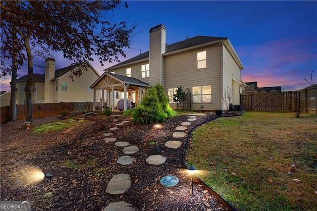 1070 Cureton Dr, Austell, GA 30106 - rear view of property with a gazebo, a chimney, a fenced backyard, and a gate
