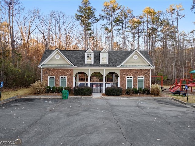 1070 Cureton Dr, Austell, GA 30106 - view of front facade with brick siding, uncovered parking, and a porch