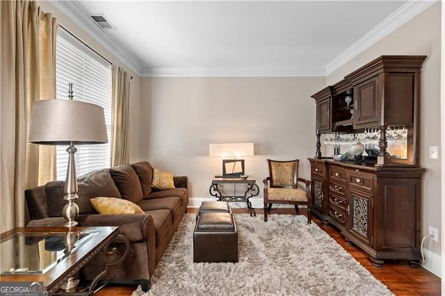 1070 Cureton Dr, Austell, GA 30106 - living area with crown molding and dark wood-style floors
