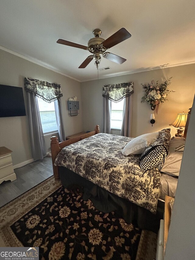 815 W Crawford St, Dalton, GA 30720 - bedroom featuring multiple windows, ornamental molding, wood finished floors, a ceiling fan, and baseboards