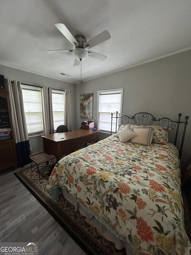 815 W Crawford St, Dalton, GA 30720 - bedroom featuring wood finished floors, ornamental molding, multiple windows, and ceiling fan