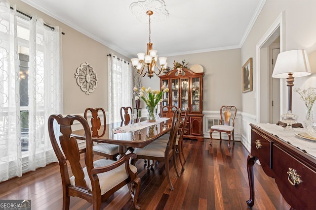 595 S Antioch Rd, Mcdonough, GA 30252 - dining room with plenty of natural light, a chandelier, dark wood-style floors, a wainscoted wall, and ornamental molding