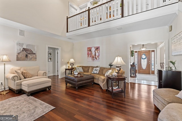 595 S Antioch Rd, Mcdonough, GA 30252 - living room with a towering ceiling, hardwood / wood-style flooring, ornamental molding, and baseboards