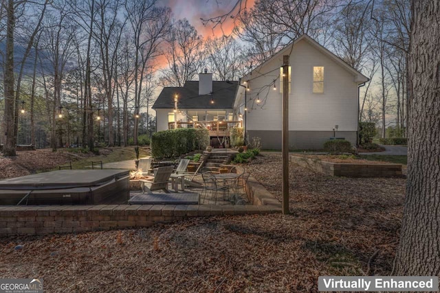 595 S Antioch Rd, Mcdonough, GA 30252 - back of house featuring an outdoor fire pit, a chimney, and a patio