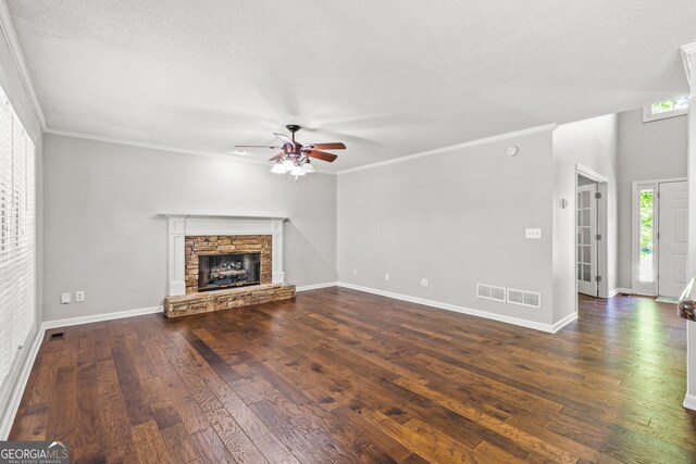 220 Drumcliff Ct, Tyrone, GA 30290 - unfurnished living room with ceiling fan, hardwood / wood-style floors, ornamental molding, baseboards, and a stone fireplace