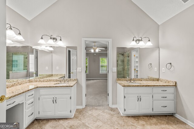 220 Drumcliff Ct, Tyrone, GA 30290 - full bathroom featuring a stall shower, ceiling fan, two vanities, tile patterned flooring, and high vaulted ceiling