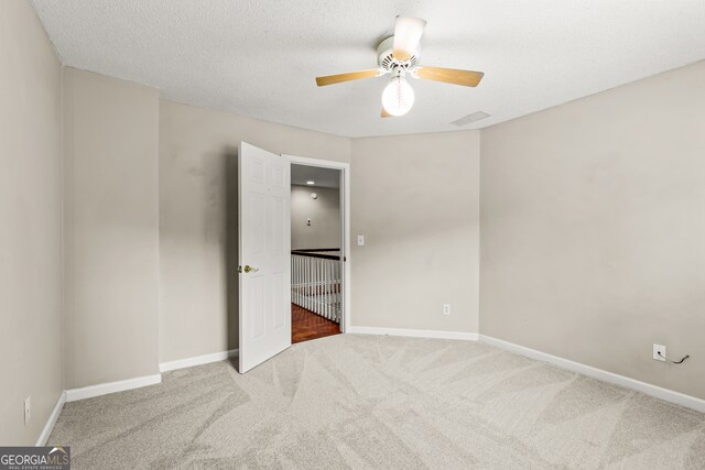 220 Drumcliff Ct, Tyrone, GA 30290 - empty room with carpet flooring, a ceiling fan, and baseboards