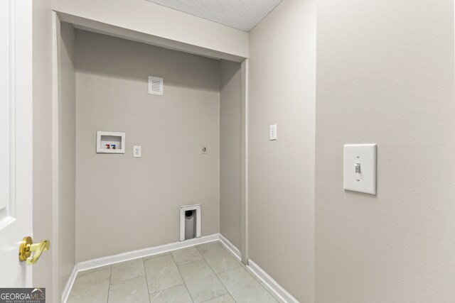 220 Drumcliff Ct, Tyrone, GA 30290 - laundry room featuring washer hookup, hookup for an electric dryer, baseboards, and light tile patterned floors