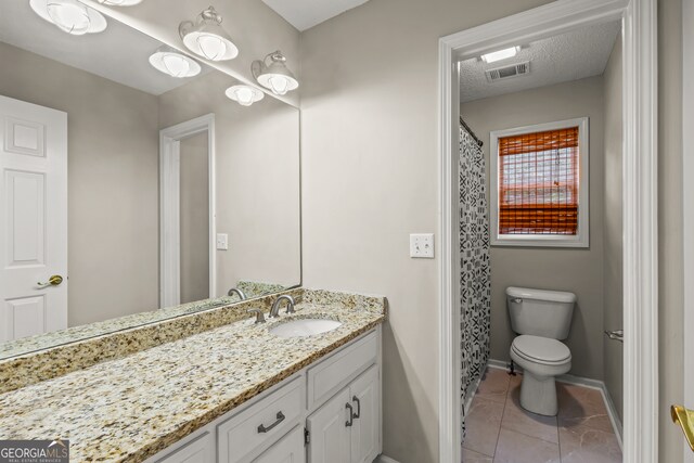 220 Drumcliff Ct, Tyrone, GA 30290 - bathroom featuring vanity, toilet, baseboards, tile patterned floors, and a shower with shower curtain