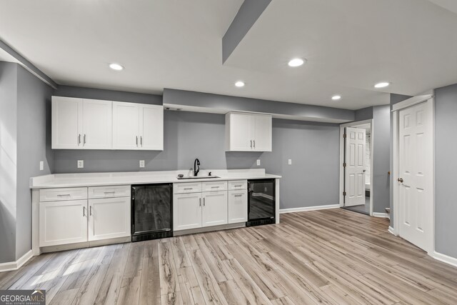 220 Drumcliff Ct, Tyrone, GA 30290 - kitchen featuring beverage cooler, a sink, white cabinets, light countertops, and recessed lighting