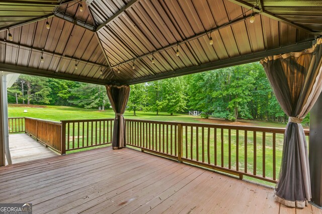 220 Drumcliff Ct, Tyrone, GA 30290 - deck featuring a yard, view of wooded area, and a gazebo