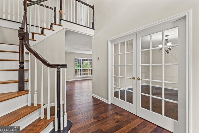 220 Drumcliff Ct, Tyrone, GA 30290 - foyer with wood finished floors, french doors, stairs, and baseboards