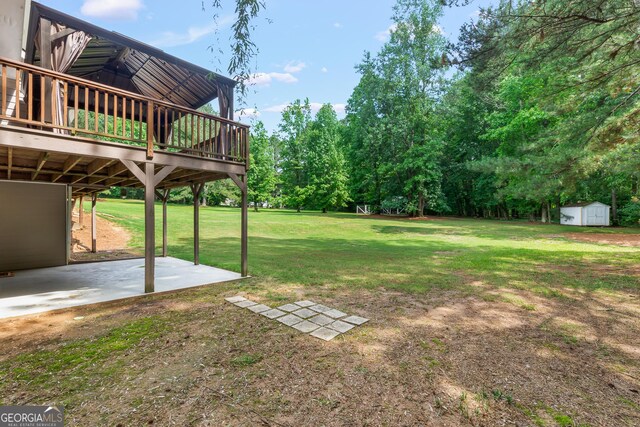 220 Drumcliff Ct, Tyrone, GA 30290 - view of grassy yard featuring a patio area and a wooden deck