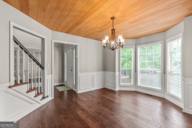 220 Drumcliff Ct, Tyrone, GA 30290 - spare room featuring wainscoting, a chandelier, wood-type flooring, stairway, and a decorative wall