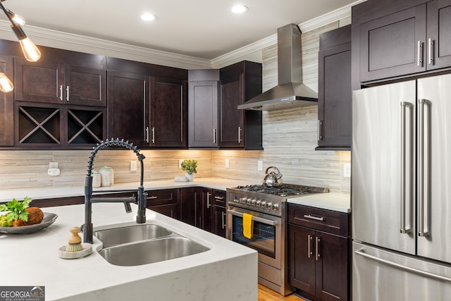 1354 Mcpherson Ave SE, Atlanta, GA 30316 - kitchen featuring high quality appliances, wall chimney exhaust hood, a sink, light countertops, and dark brown cabinetry