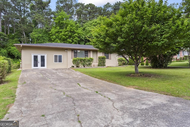 624 Lyle Dr SE, Marietta, GA 30067 - view of front of home featuring french doors, a front lawn, and driveway