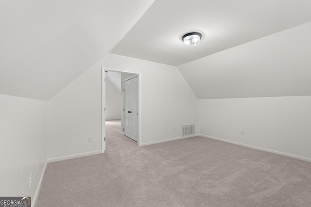 9 Wimbledon Ct, Statesboro, GA 30458 - bonus room with light carpet, vaulted ceiling, and baseboards