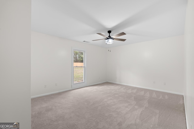 9 Wimbledon Ct, Statesboro, GA 30458 - spare room featuring a ceiling fan, carpet floors, and baseboards